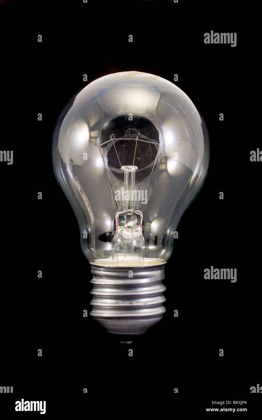 tungsten lightbulb isolated on black Stock Photo