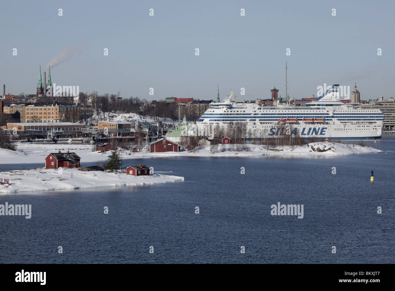FERRY, HELSINKI HARBOUR WINTER: A Silja Line ferry (Symphony) docks in Helsinki main harbour at the heart of the city in Winter Finland Stock Photo