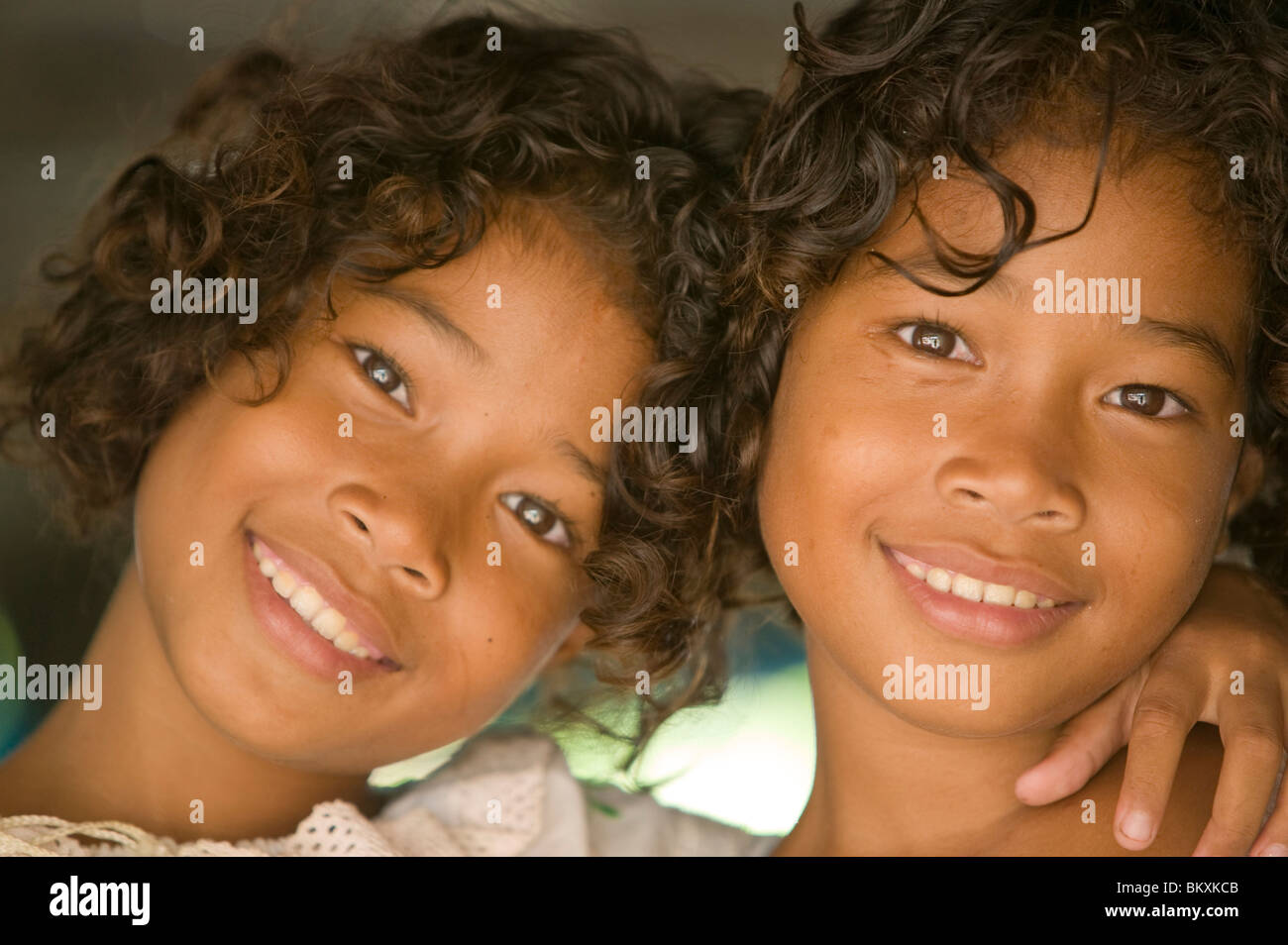 Girls face an uncertain future on Funafuti atol Tuvalu which is threatened by global warming induced sea level rise Stock Photo