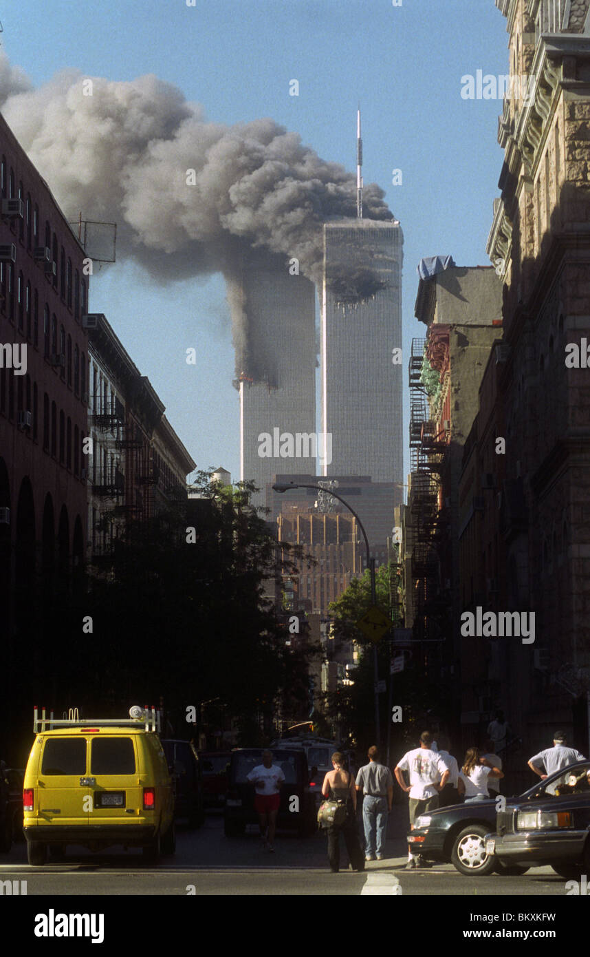 Crowds on West Broadway view the twin towers of the World Trade Center on the morning of September 11th 2001 Stock Photo