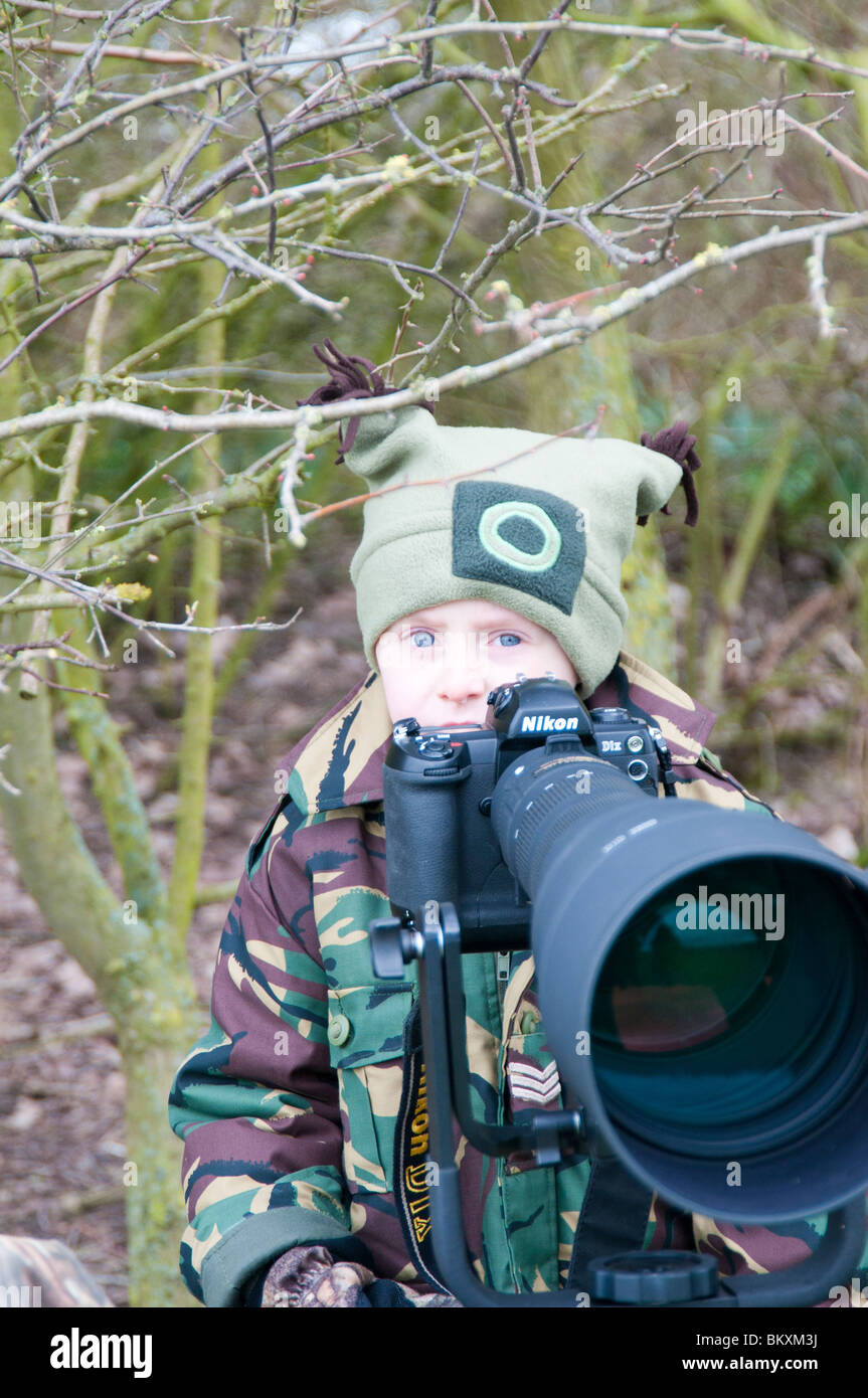 Boy using camera Stock Photo - Alamy