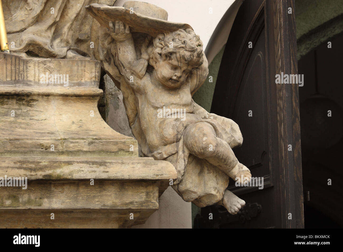 Cherub sculpture in Minoritsky cloister, Opava. Czech Republic. Stock Photo