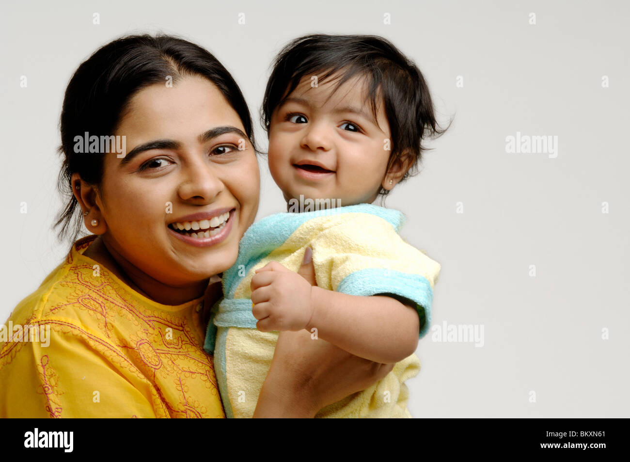 Indian Mother & Baby in Joyful mood ; MR Stock Photo