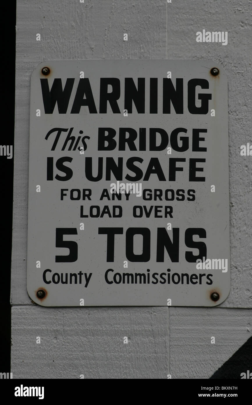 Warning sign that this bridge is unsafe for heavy loads. Stock Photo