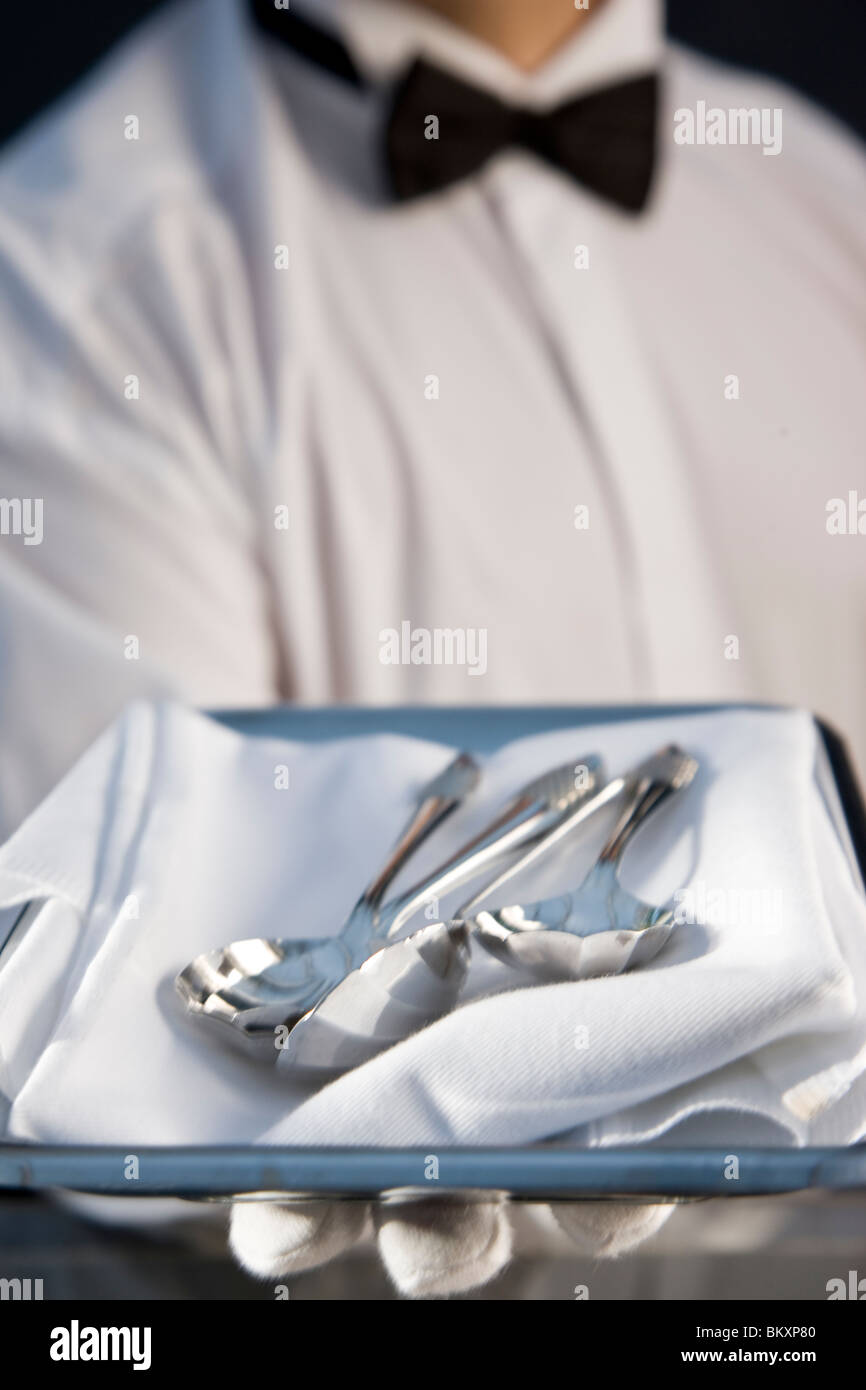 Waiter holding tray high hi-res stock photography and images - Alamy