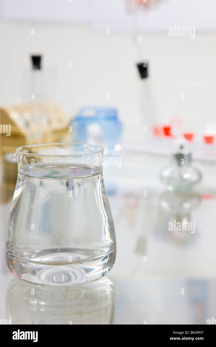 Close up of a glass container filled with fluid in a chemistry lab