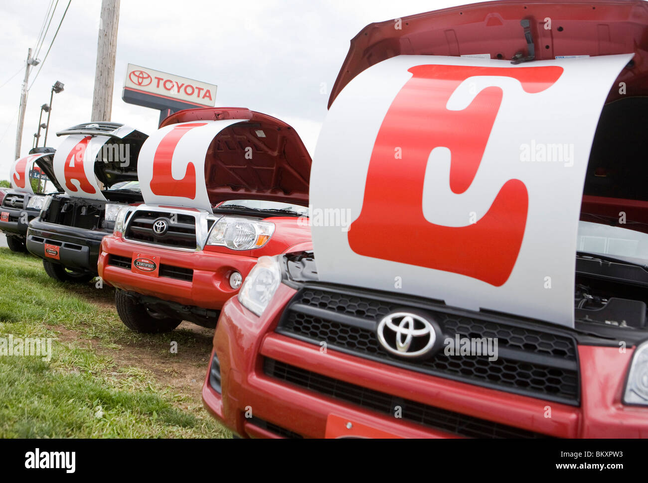 Toyota vehicles on a dealership lot with a "Sale" sign Stock Photo Alamy