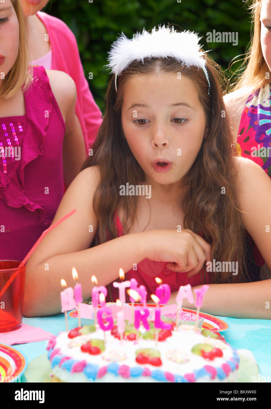 Child blowing out candles teen hi-res stock photography and images - Alamy