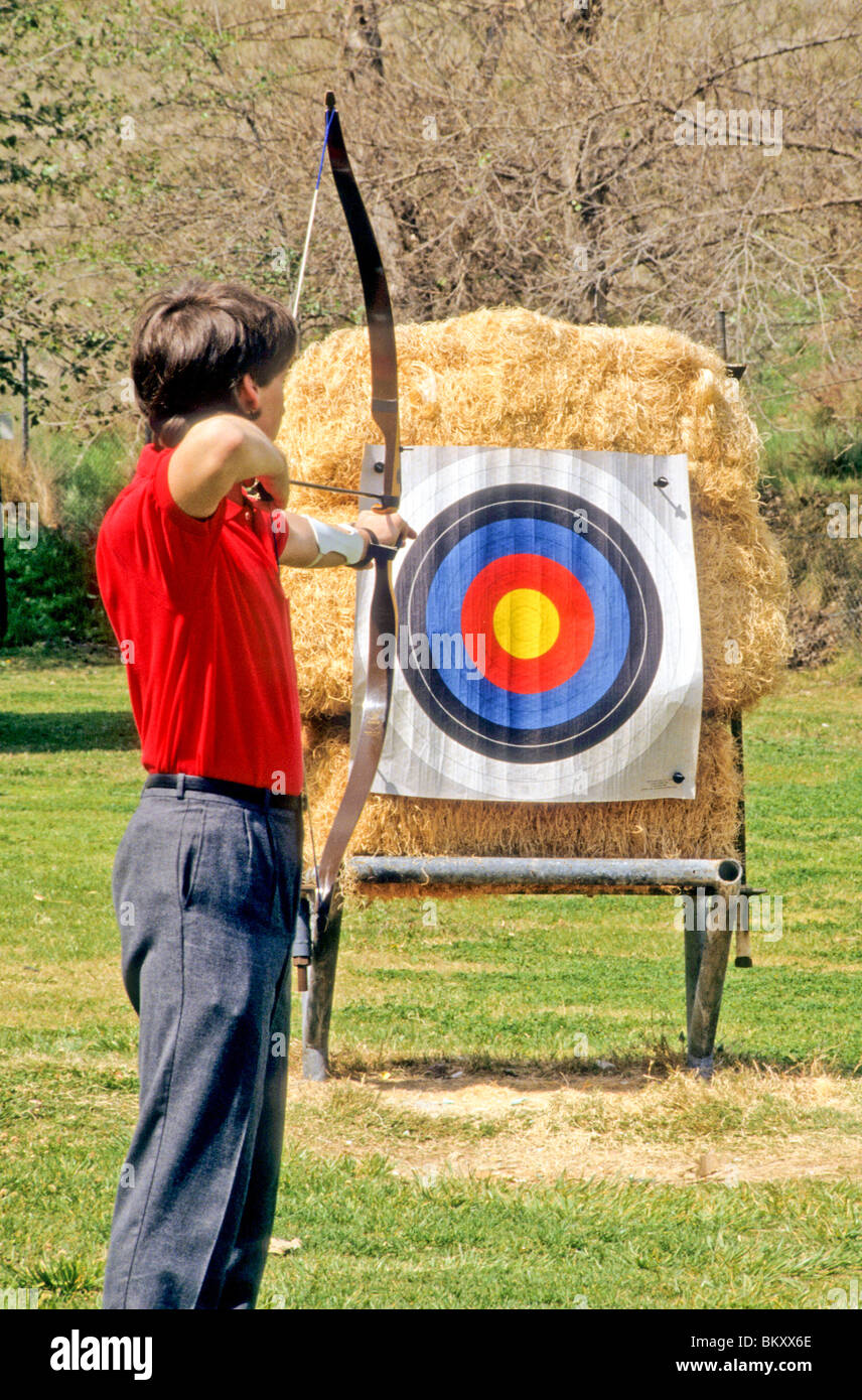 Archer bow arrow target stretch draw tight aim point sharp goal bulls