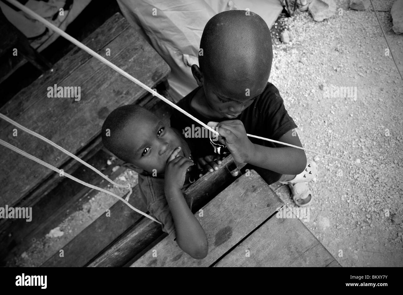 Orphans at a temporary makeshift dwelling compound in the suburbs of Port-au-Prince after a 7.0 magnitude earthquake struck Haiti on 12 January 2010 Stock Photo