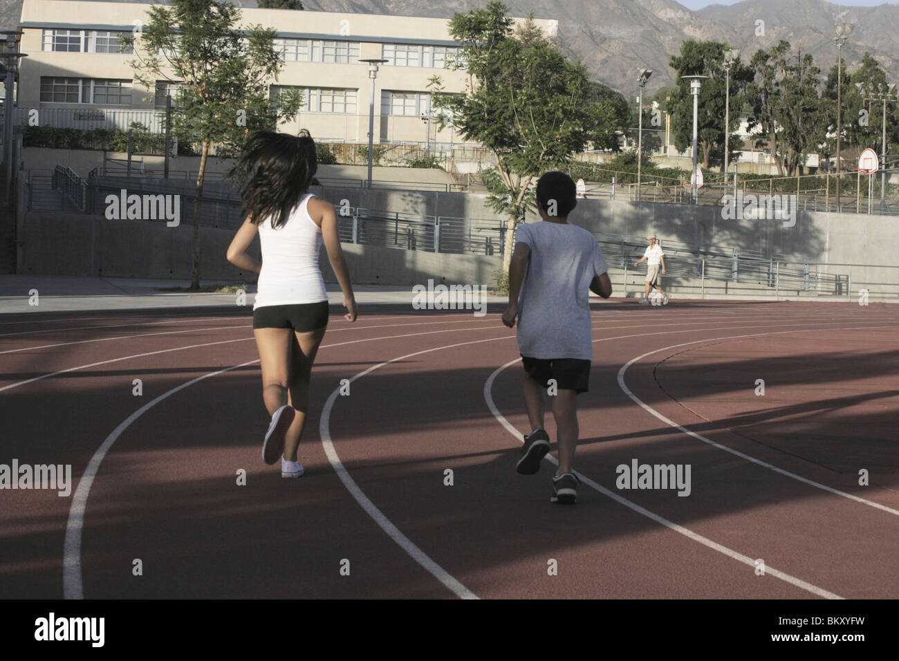Children running track hi-res stock photography and images - Alamy