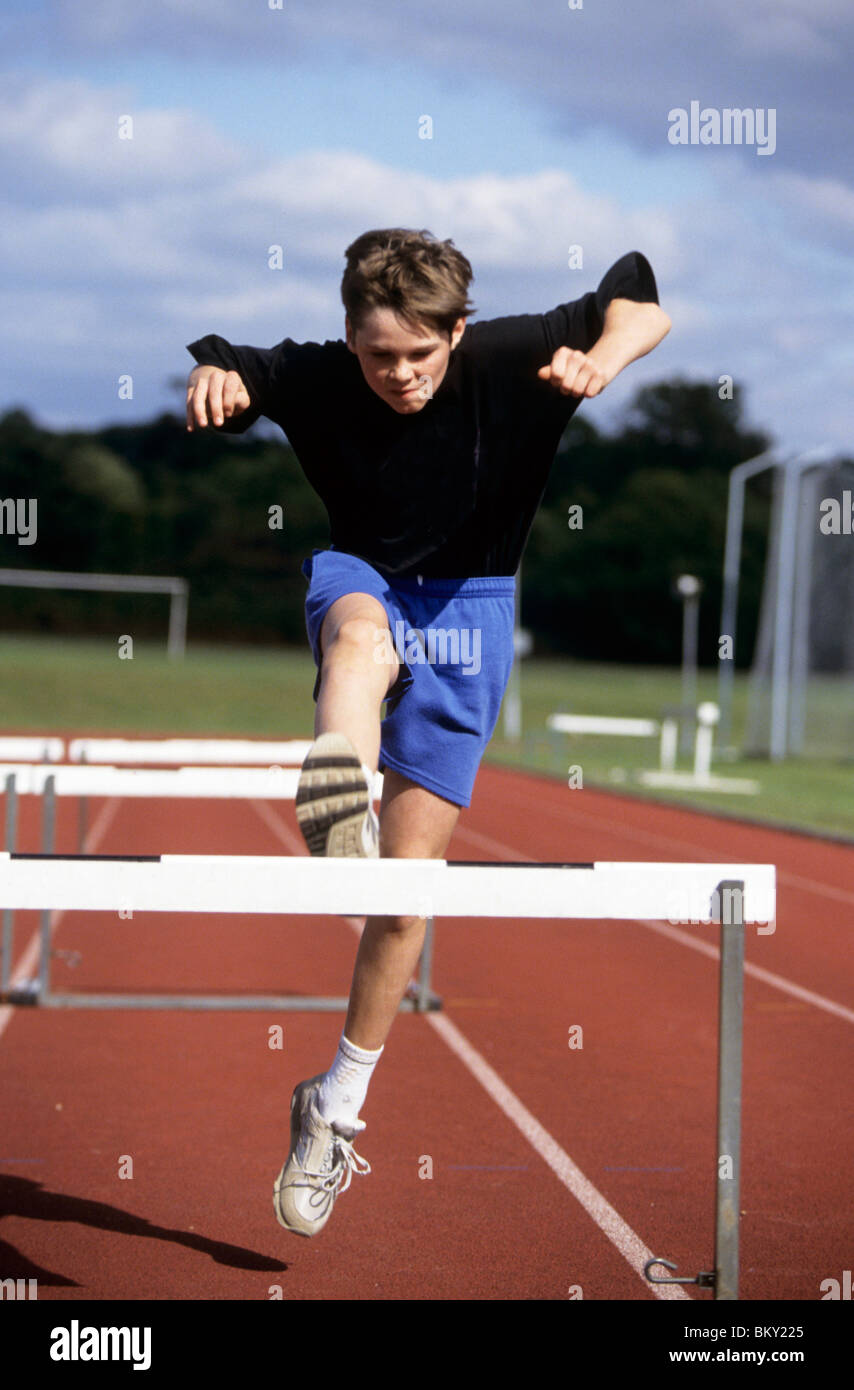 Boy running hurdles hires stock photography and images Alamy