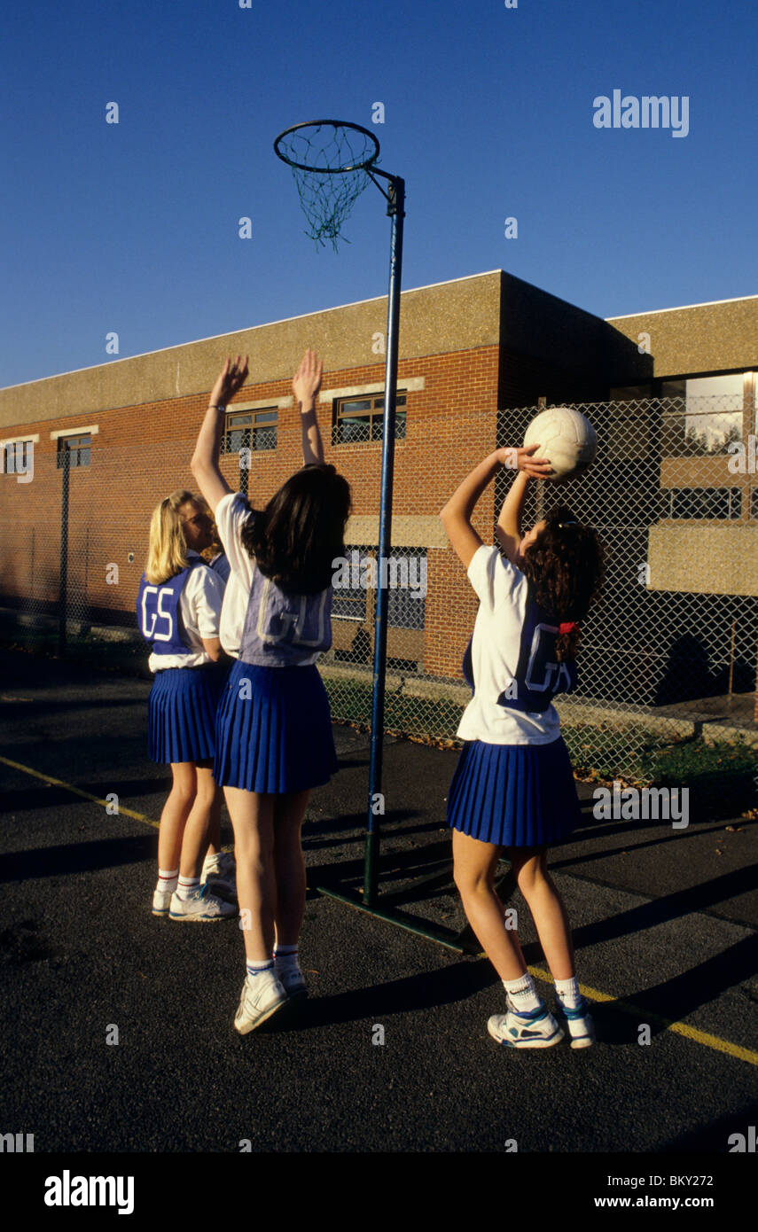 Girls playing netball at school Stock Photo