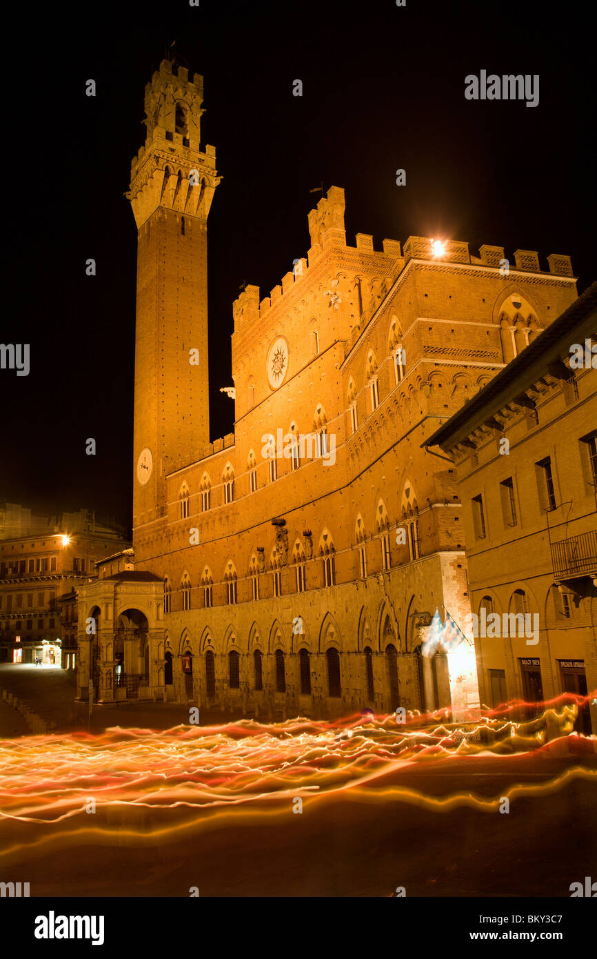 Siena - Town-hall and Torre del Mangia in the night by the cross-way with  the candles Stock Photo - Alamy