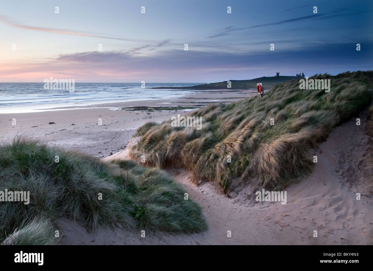 Dunstanburgh Castle viewed from Embleton Bay Stock Photo