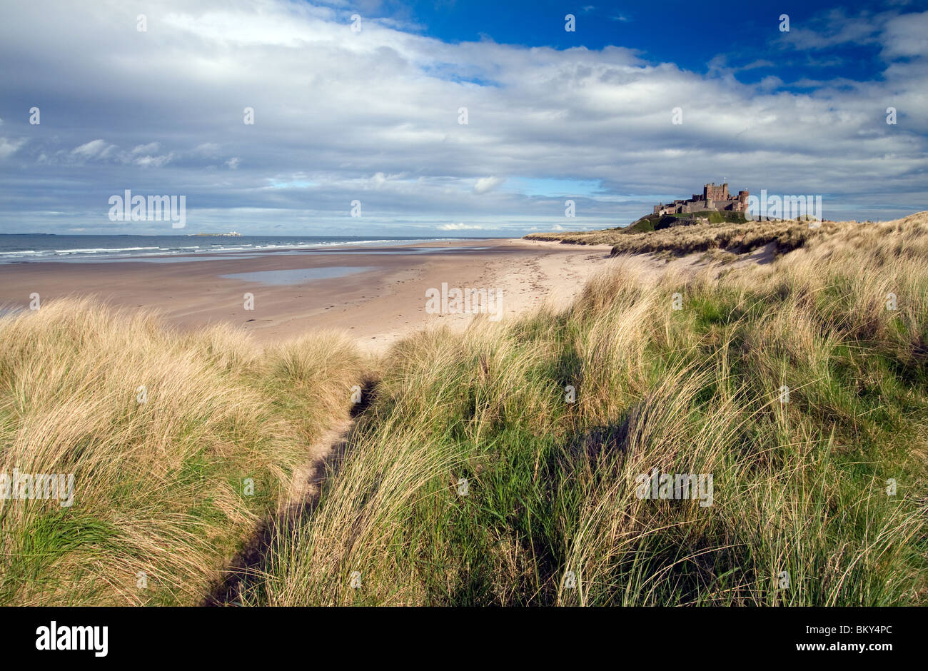 Bamburgh Castle pictured in late afternoon sunlight Stock Photo