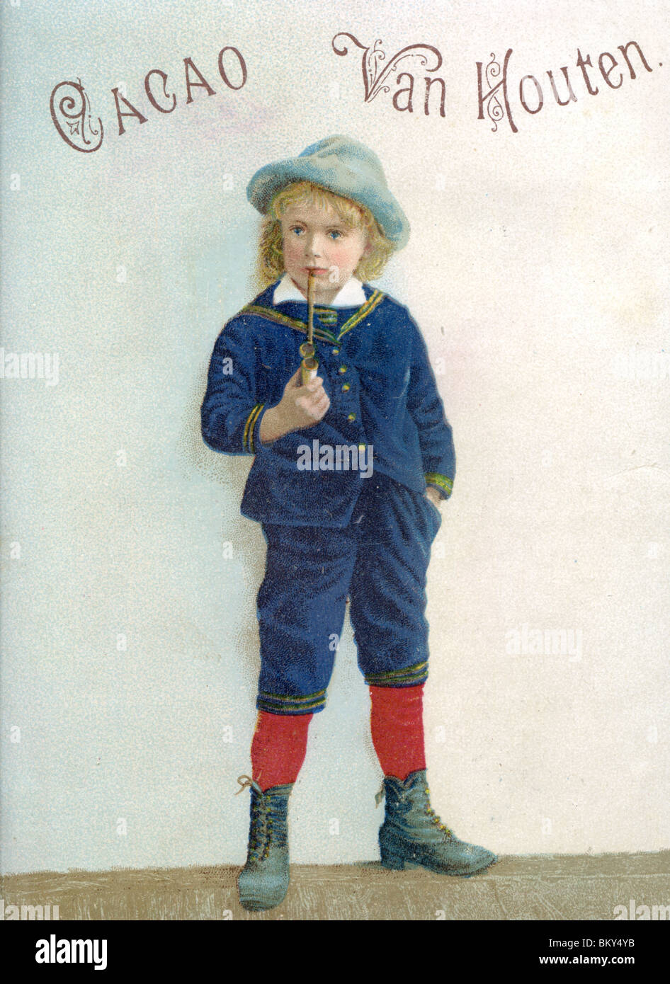 Young Boy Waiting Around Smoking a Pipe Stock Photo