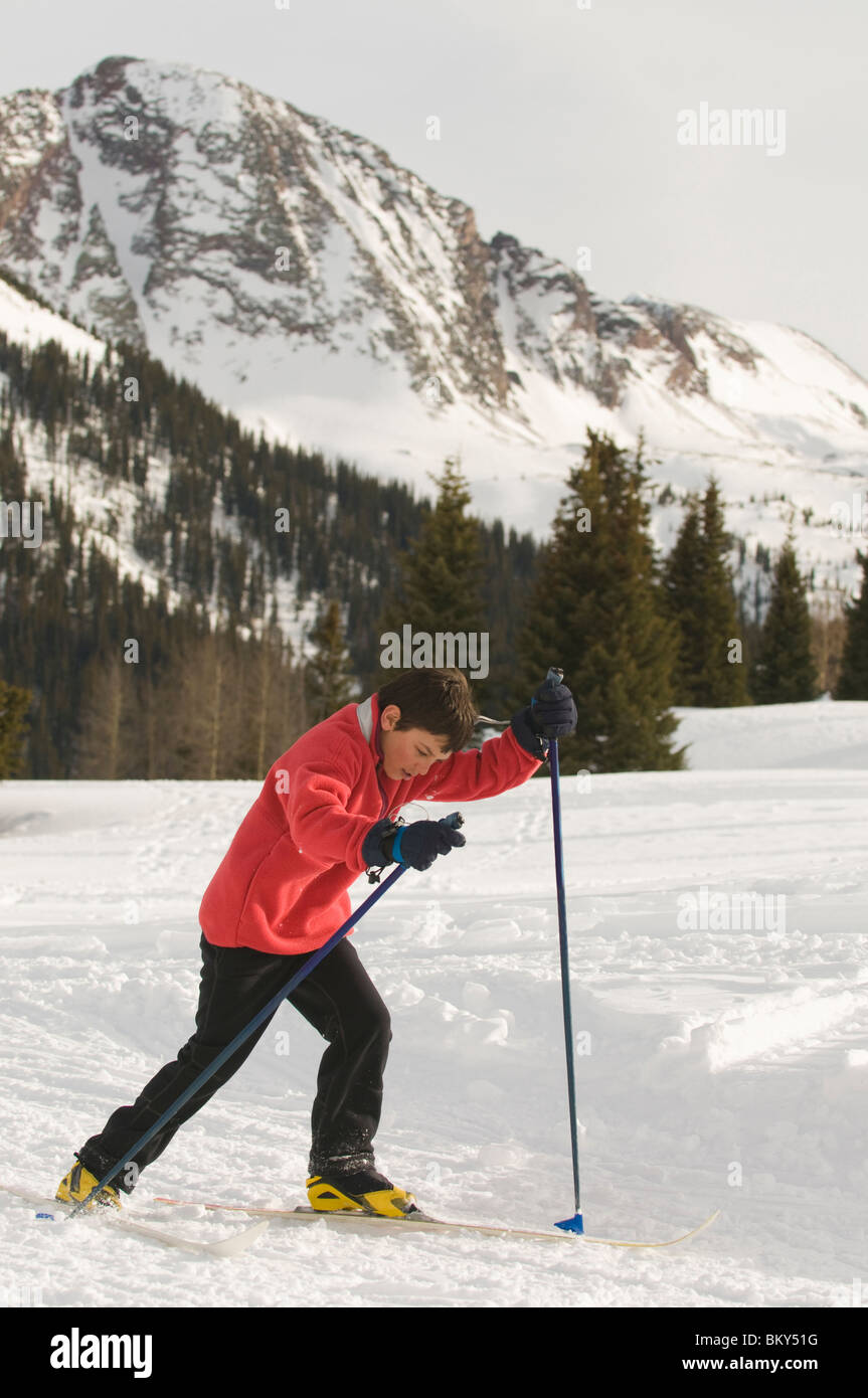 A young boy cross country skiing in the San Juan National Forest