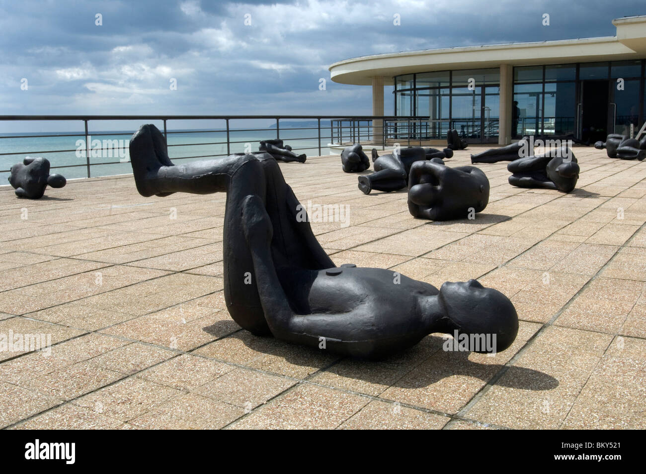 Antony Gormley's 60 'Critical Mass' sculptures on the roof of the Art Deco De La Warr Pavilion in Bexhill on Sea, East Sussex.. Stock Photo