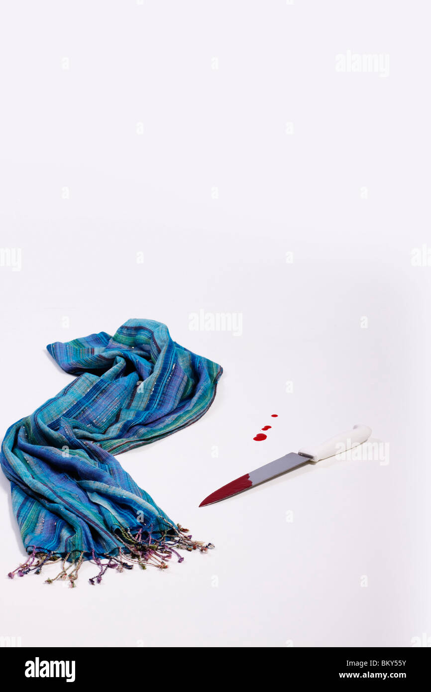 A woman's scarf abandoned on the floor next to a bloody knife and spilt  blood. Isolated Stock Photo - Alamy