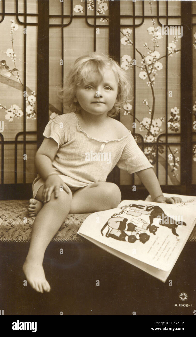 Girl sitting on a Chair reading her Book (c.1916 Stock Photo - Alamy