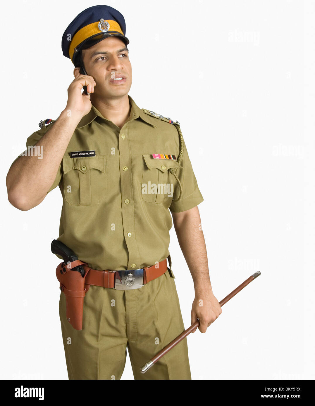 Policeman talking on a mobile phone Stock Photo