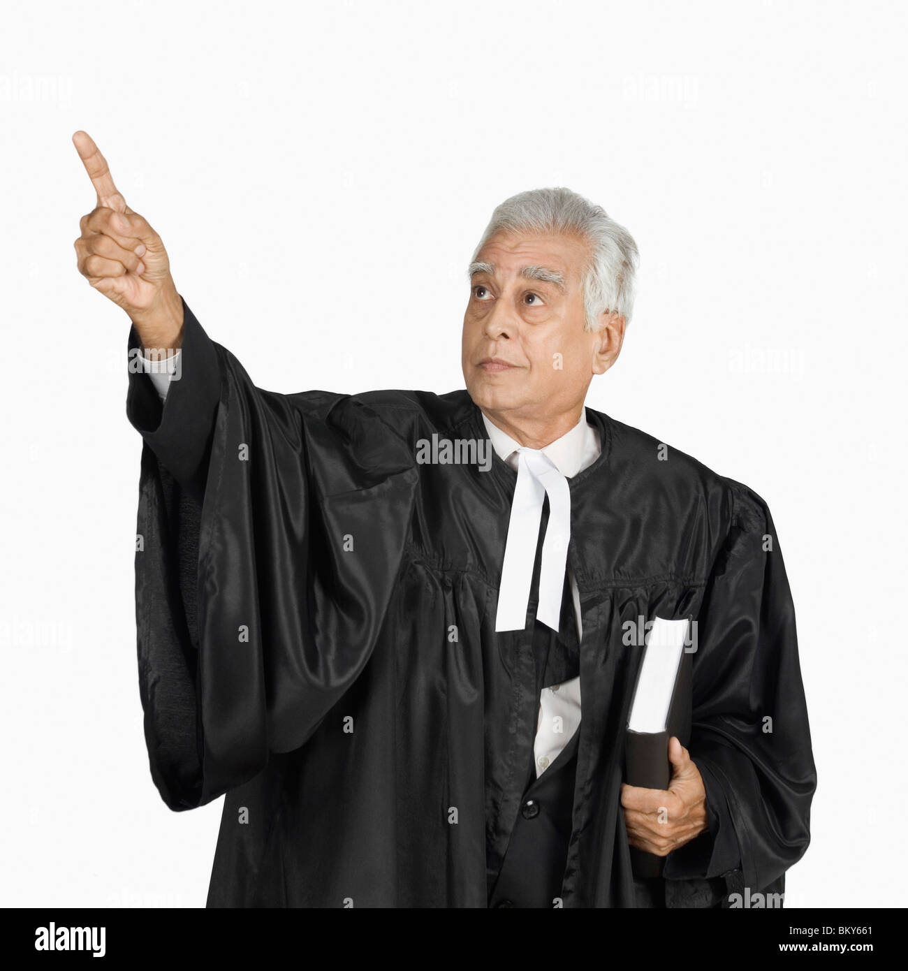 Lawyer holding a book and making an oral argument Stock Photo