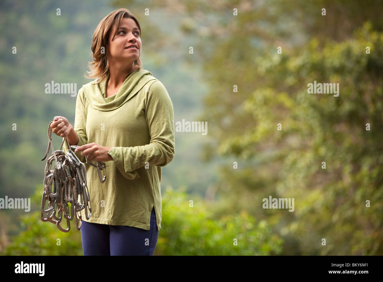 A woman prepares her rope for a climb in Brazil. Stock Photo