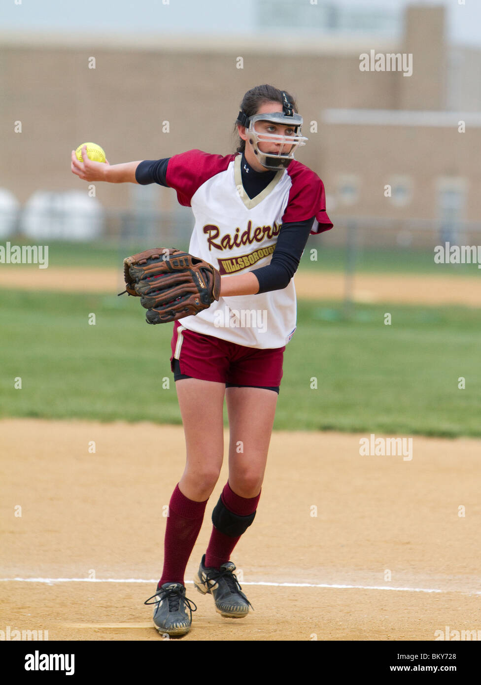 Girls high school softball pitcher in her delivery Stock Photo Alamy