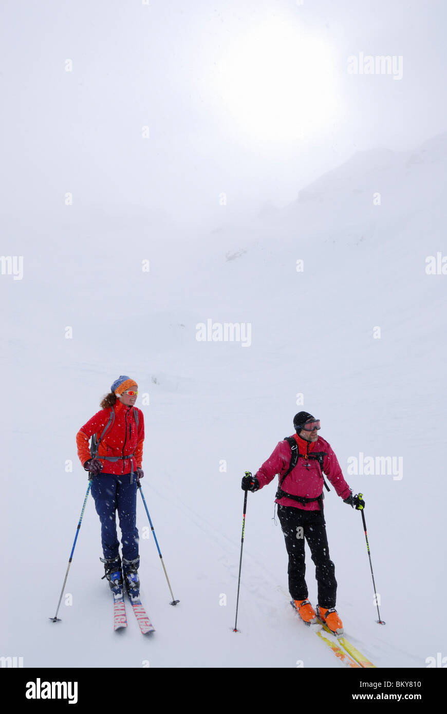 Skiers in diffus light, Cresta Bianca, Cristallo range, Dolomites, Veneto, Italy Stock Photo
