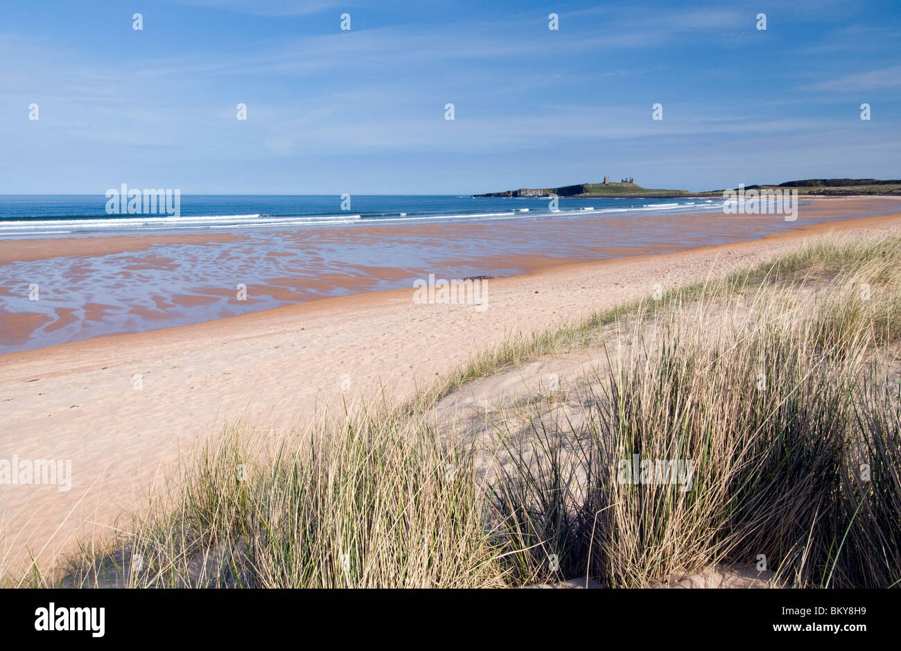 Dunstanburgh Castle viewed from Embleton Bay Stock Photo