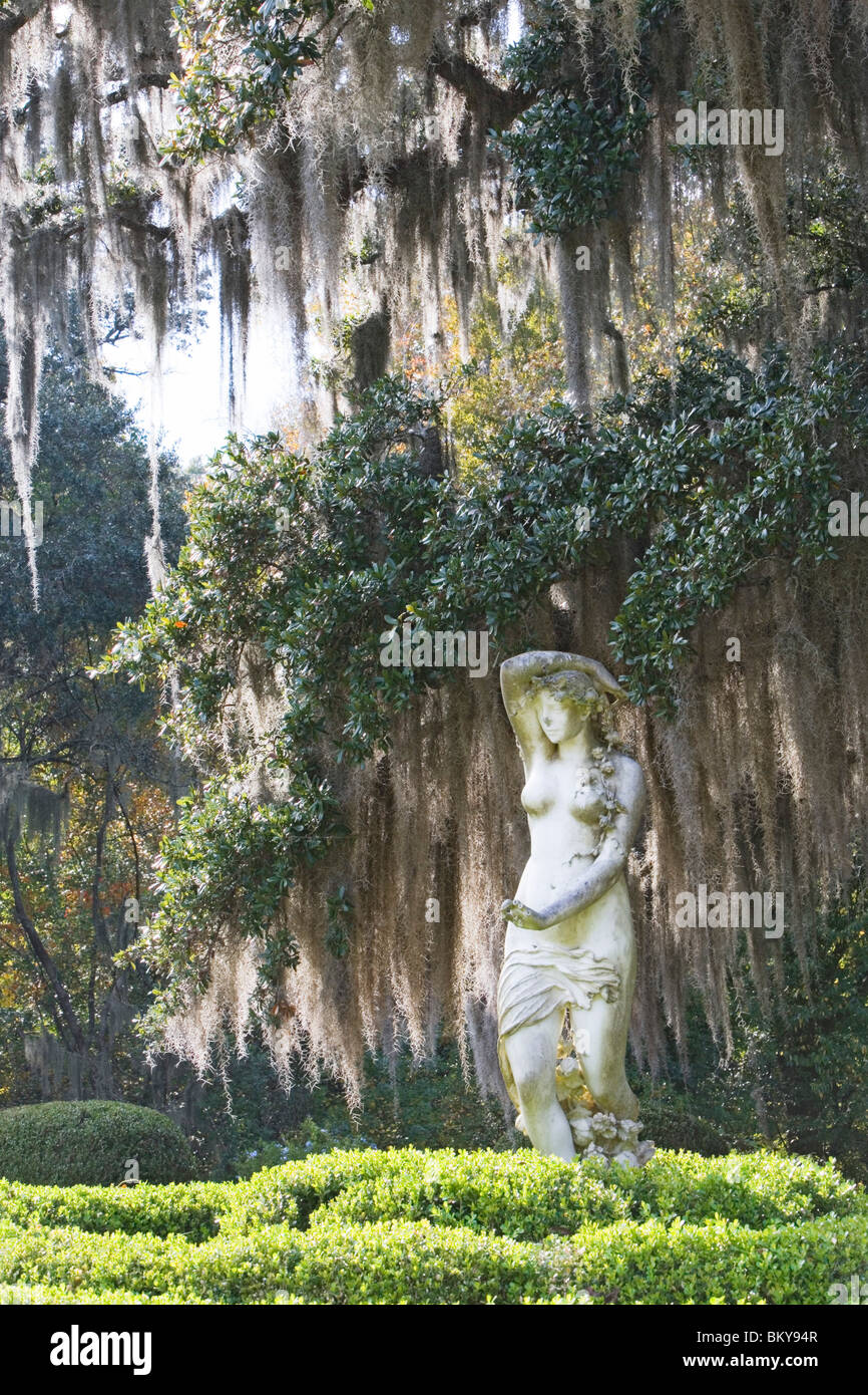 A statue and old oak trees overgrown with spanish moss, Afton Villa Gardens, St. Francisville, Louisiana, USA Stock Photo