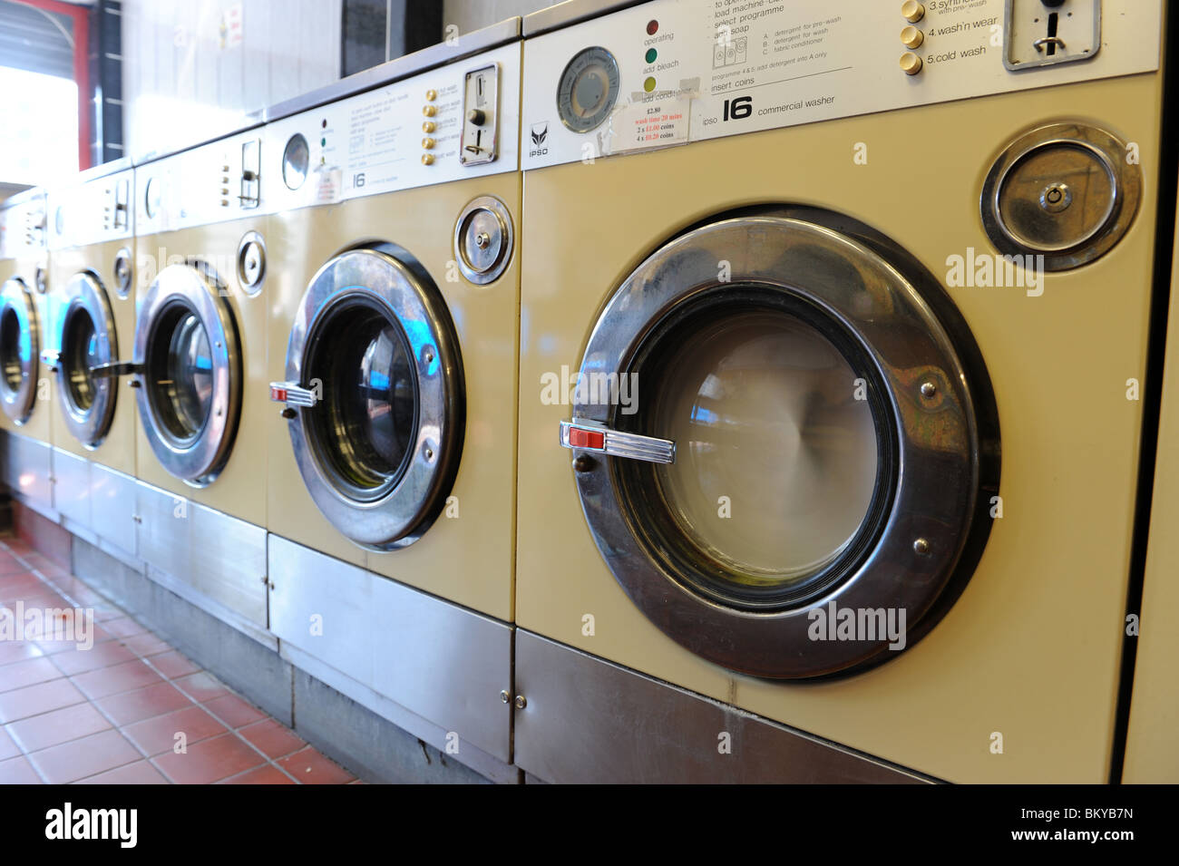 Washing machine at launderette England Uk Stock Photo