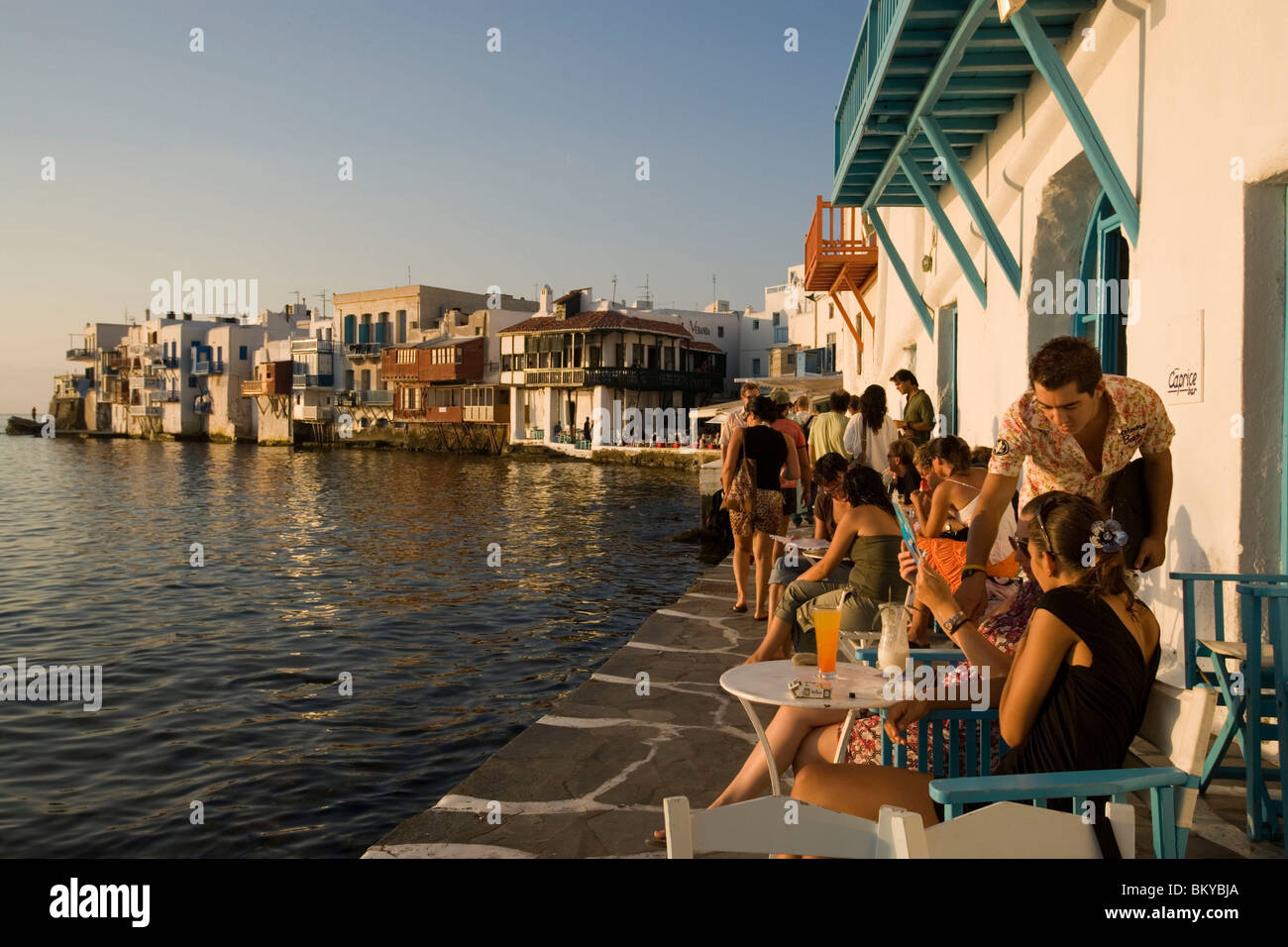 People sitting in the Caprice Bar directly at sea, Little Venice, Mykonos-Town,  Mykonos, Greece Stock Photo - Alamy