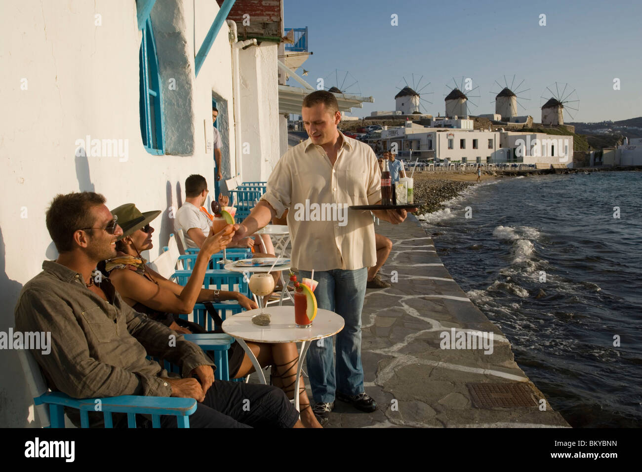 Waiter serving the cocktail Sundowner in the Caprice Bar directly at sea,  Little Venice, Mykonos-Town, Mykonos, Greece Stock Photo - Alamy