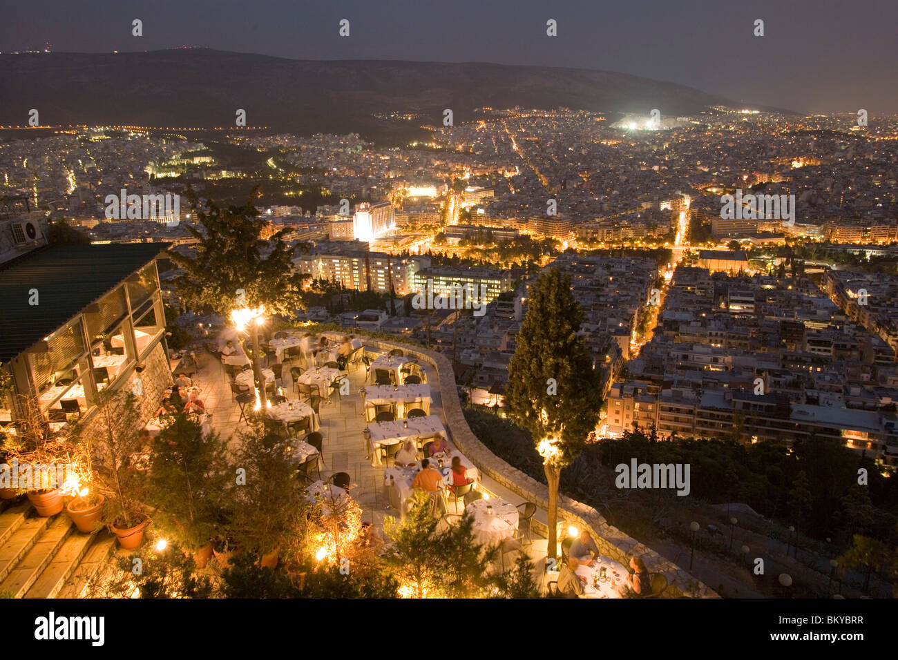 View from the Lykavittos Hill over the restaurant Orizontes to the ocean of houses of the town at night, Athens, Athens-Piraeus, Stock Photo