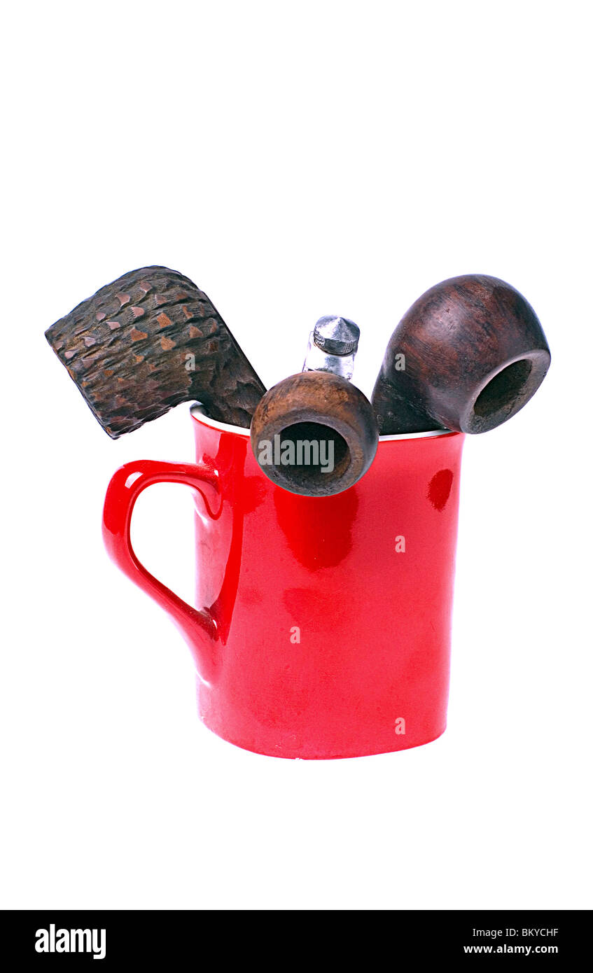 Tobacco smoking pipes in red coffee cup Stock Photo