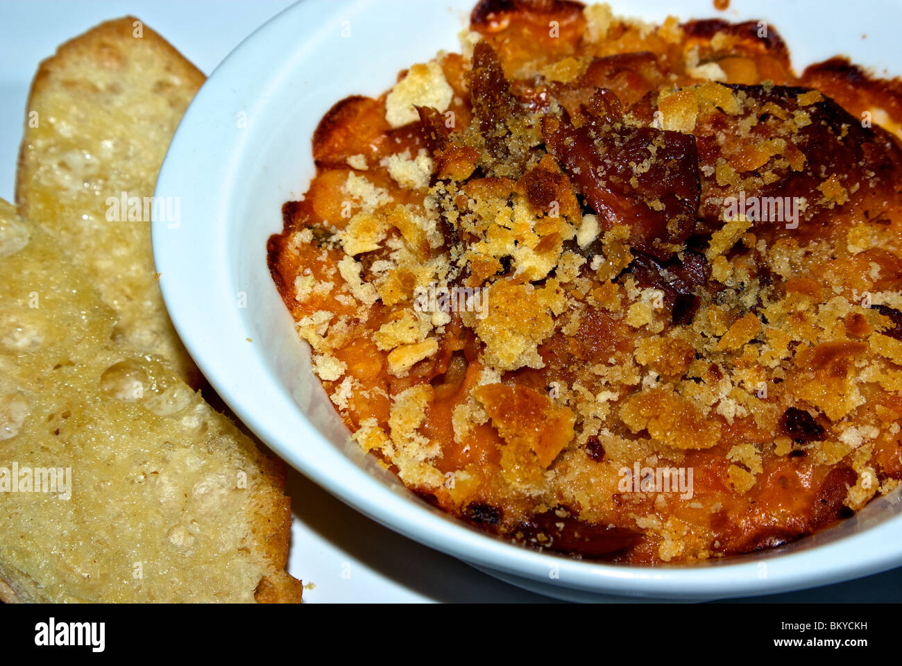 Oven baked buttered bread crumb crusted duck confit white bean