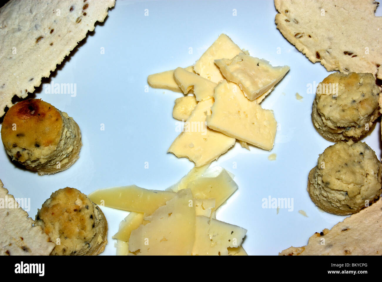 Crackers cheese selection aged gouda slices baked mini blue cheese cheesecake Stock Photo Alamy