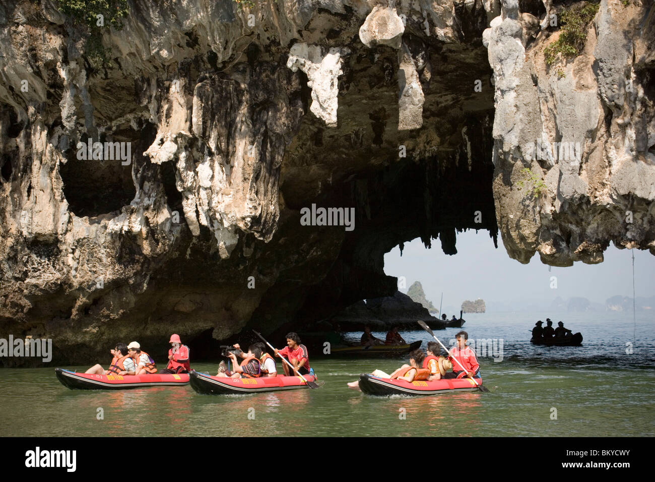 Group of tourists kayaking, passing a Karst formation, Phang-Nga Bay, Ao Phang Nga Nation Park, Phang Nga, Thailand Stock Photo