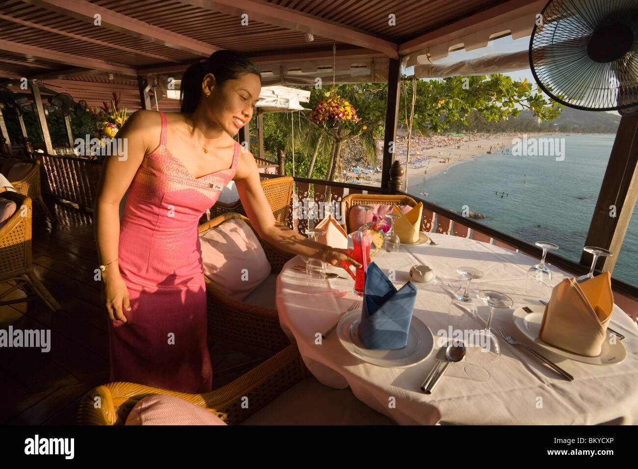 Waitress serving a cool drink, Baan Rim Pa restaurant, Patong Beach, Hat Patong, Ao Patong, Phuket, Thailand, after the tsunami Stock Photo