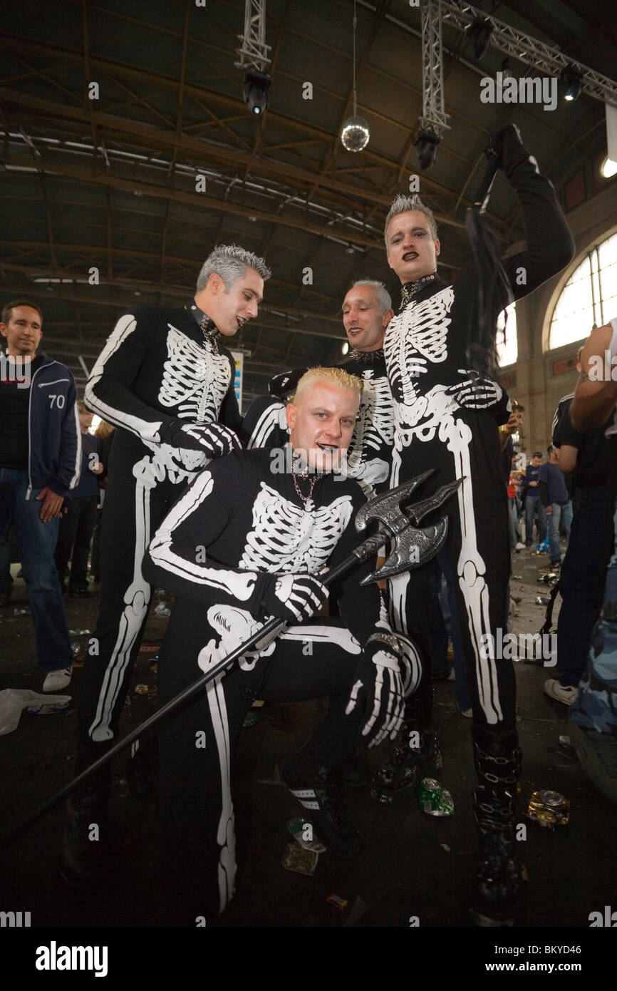 Four raver, dressed up as skeleton, at an opening in the station, Street Parade (the most attended technoparade in Europe), Zuri Stock Photo