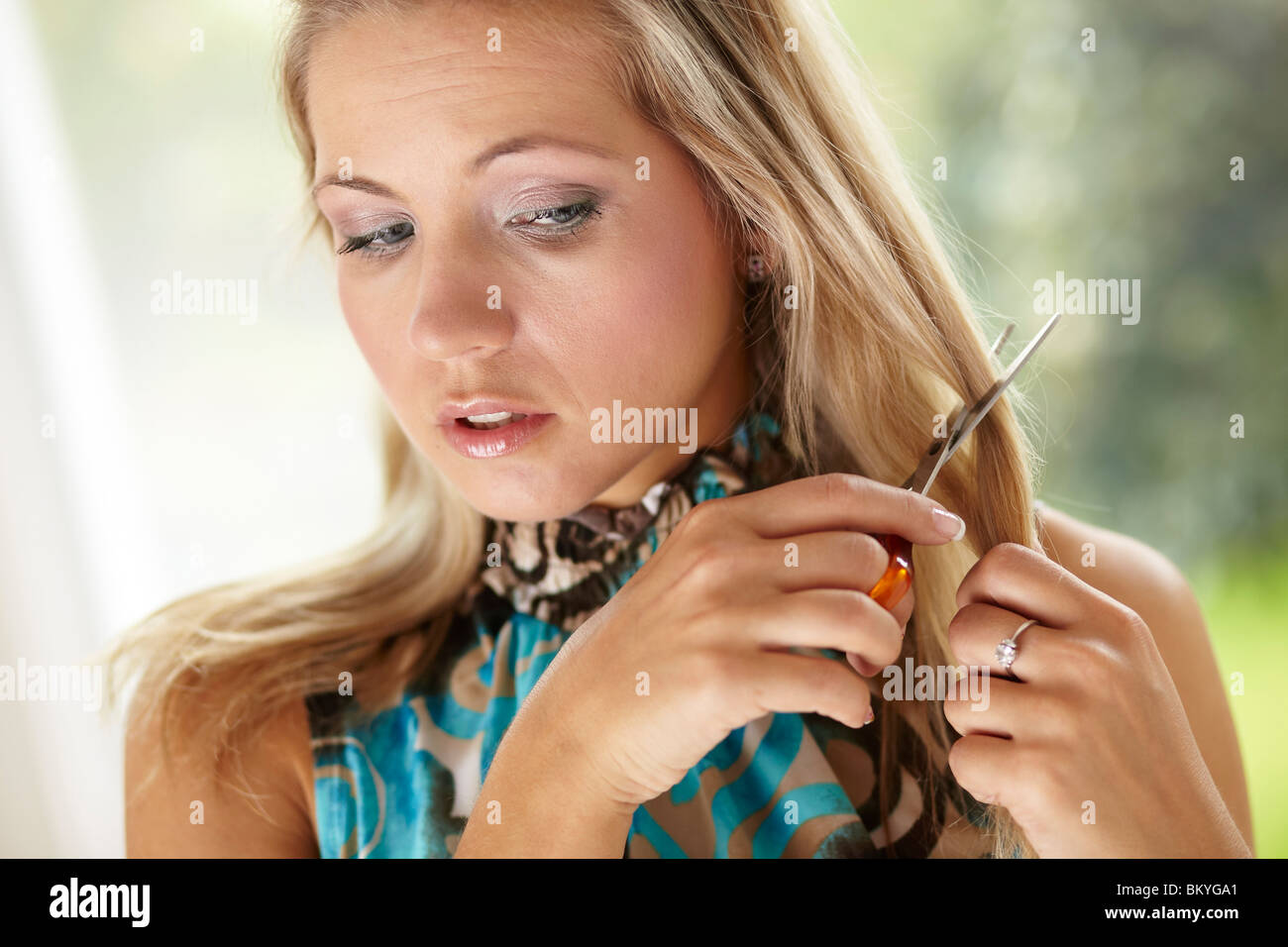 Girl cutting hair Stock Photo