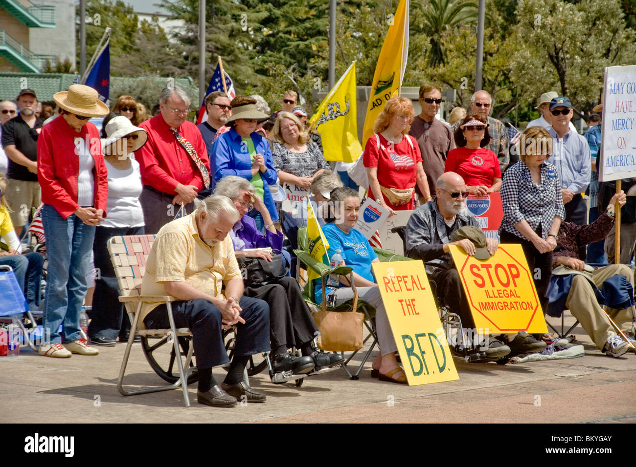 Anti-government protesters pray at a 'Tea Party' rally on April 15 (Tax Day) in Santa Ana, California. Stock Photo