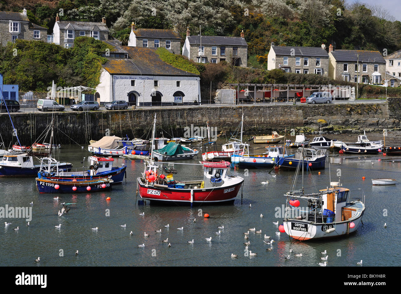 fishing boats in the harbour at porthleven in cornwall, uk Stock Photo Alamy