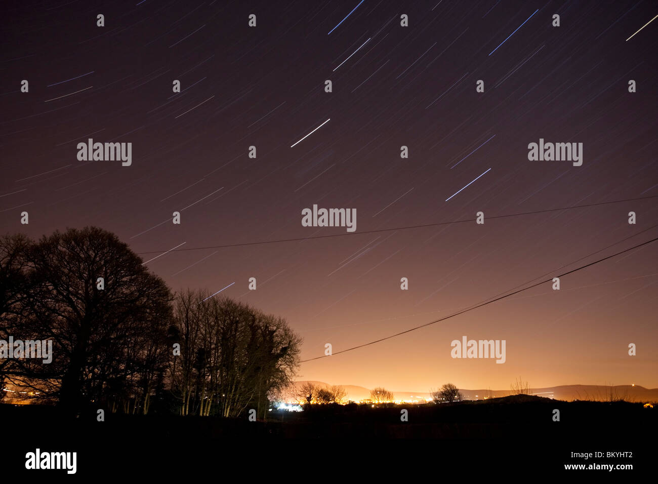 Star trail over the town of Dungiven, County Londonderry, Northern Ireland Stock Photo