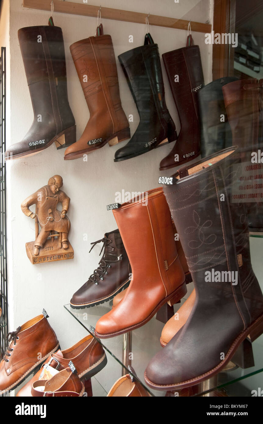 Spanish leather boots for sale in a shop window in the Calle de Toledo, central Madrid, Spain Stock Photo