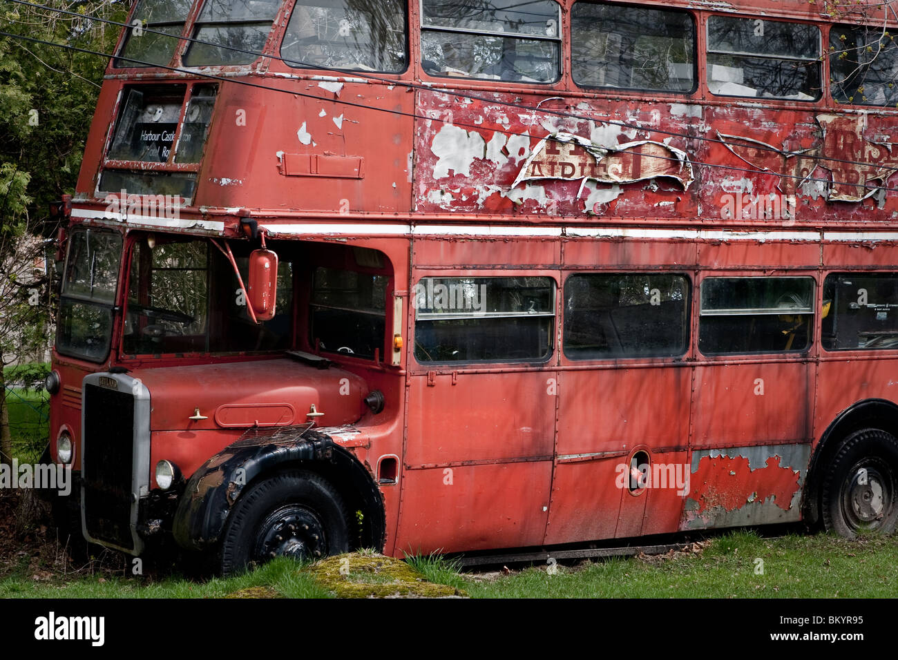 A Decaying red double decker bus is seen in the township of Augusta, Ontario, April 18, 2010. Stock Photo