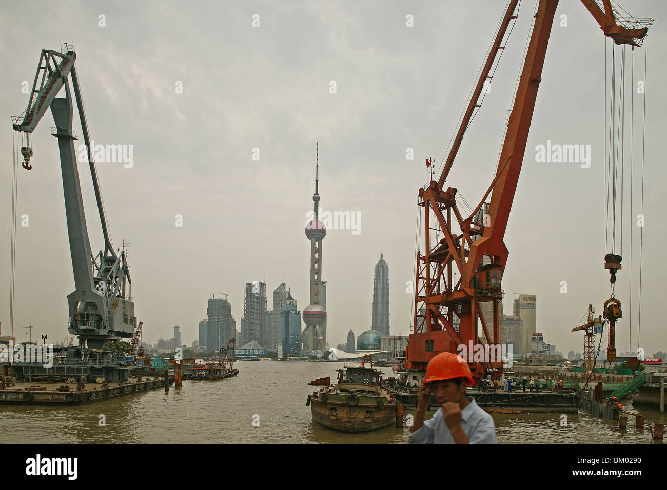Harbour, View from Waibaidu Bridge, Huangpu-River, Pudong, line of freight barges, man with helmet Stock Photo