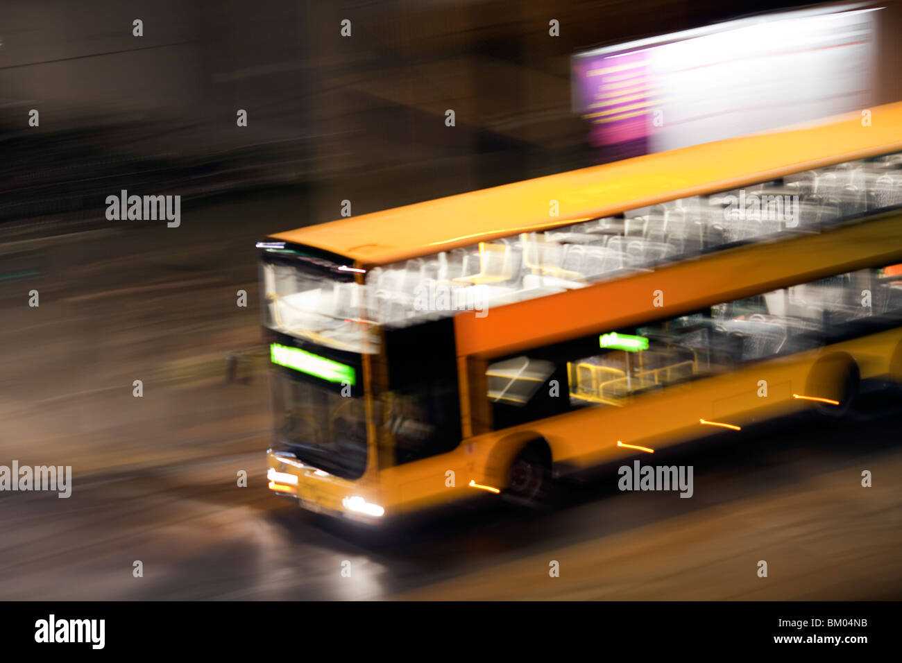 Panning shot of a bus by night, Berlin, Germany Stock Photo